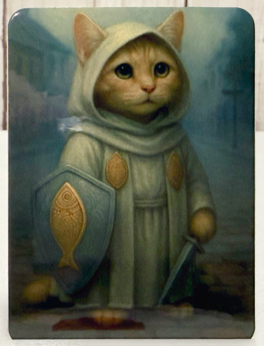 Magnet featuring a cleric cat in a hooded outfit with a shield and sword