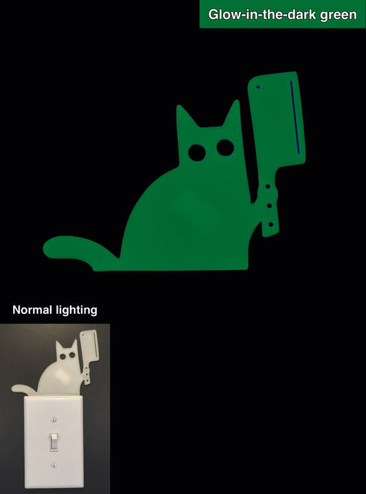 Glowplate light switch finder: glow-in-the-dark green cat with hatchet, shown in normal lighting and glow-in-the-dark conditions.
