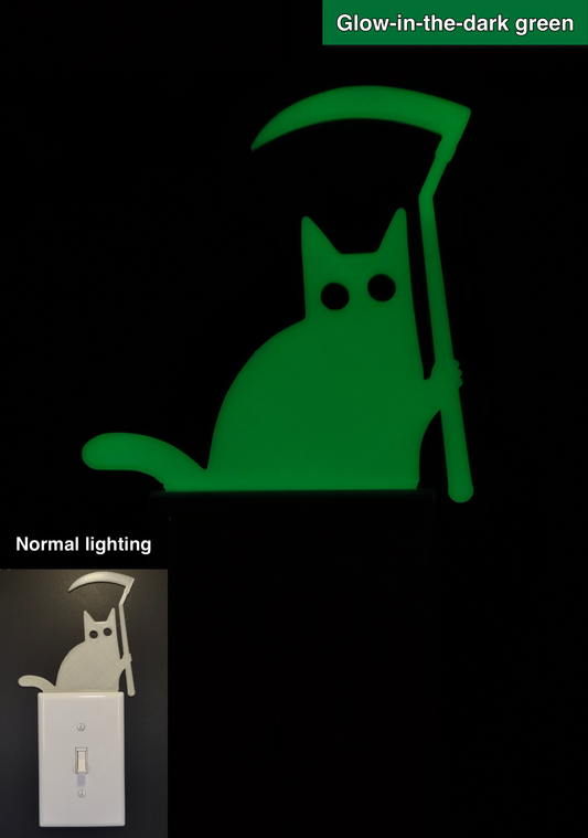 Glowplate light switch finder: glow-in-the-dark green cat with scythe, shown in normal lighting and glow-in-the-dark conditions.