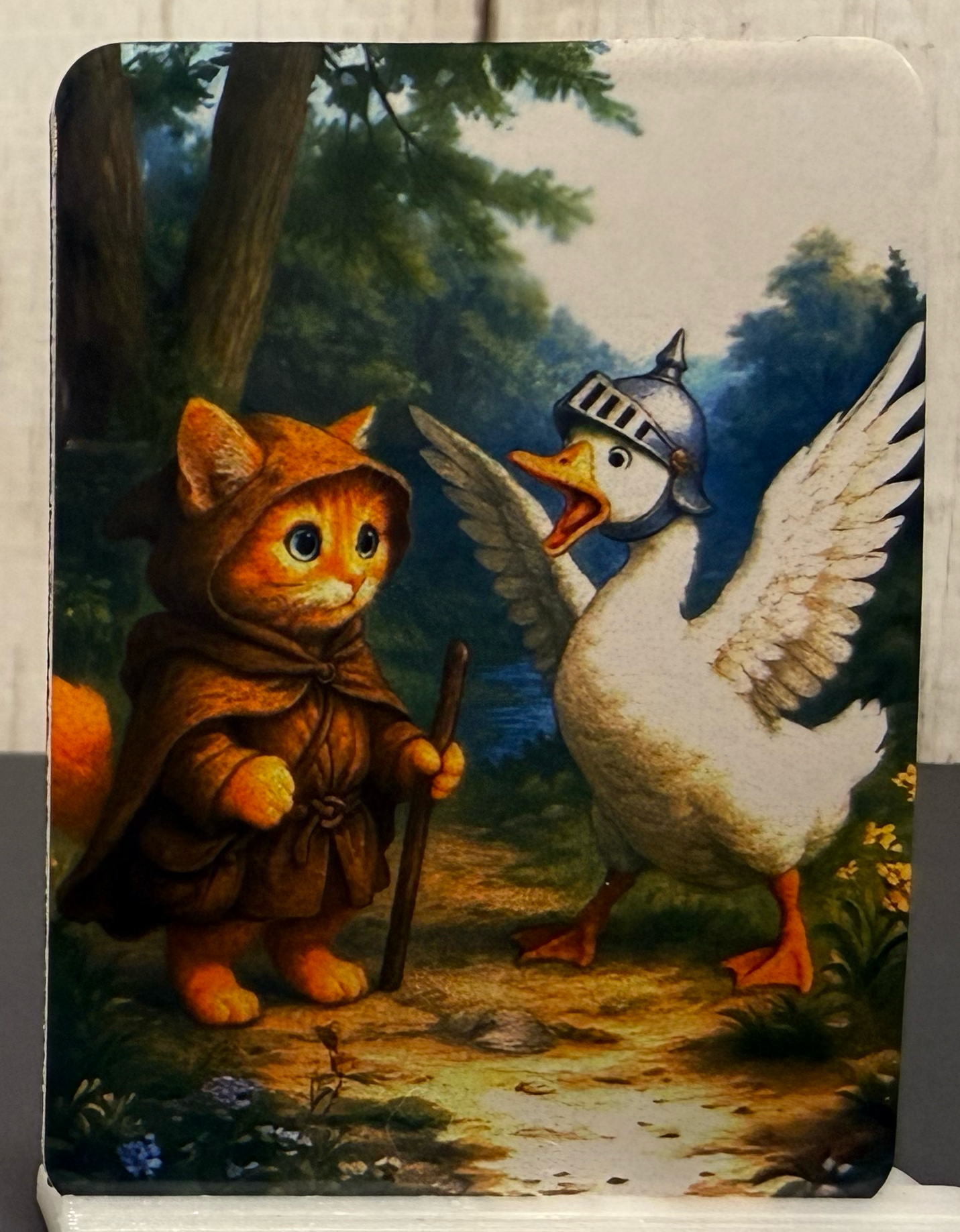 Magnet featuring an adventurer kitty and a goose guardian honking at him