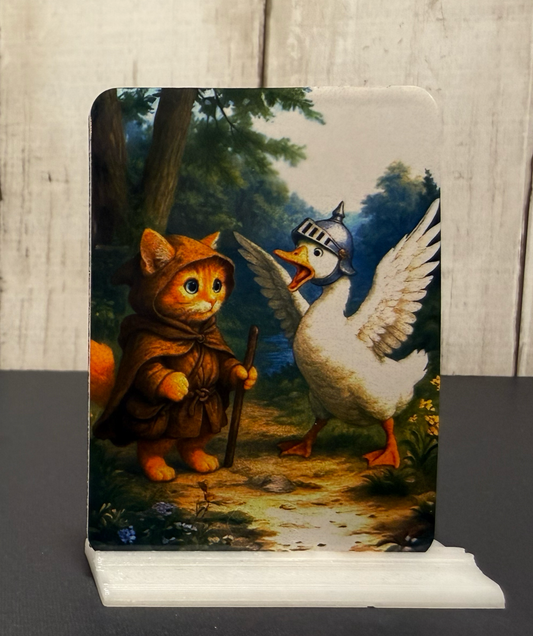 Magnet featuring an adventurer kitty and a goose guardian honking at him