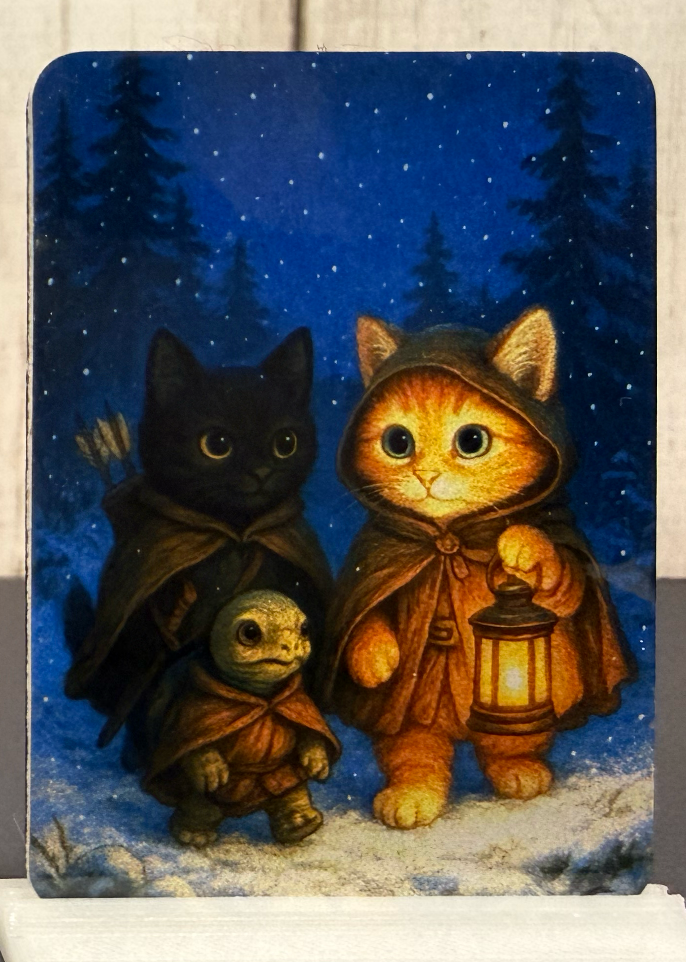 Magnet with illustration of cats and a turtle with a lantern against a night sky background