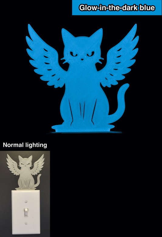 Glowplate light switch finder: glow-in-the-dark blue cat with angel wings, shown in normal lighting and glow-in-the-dark conditions.
