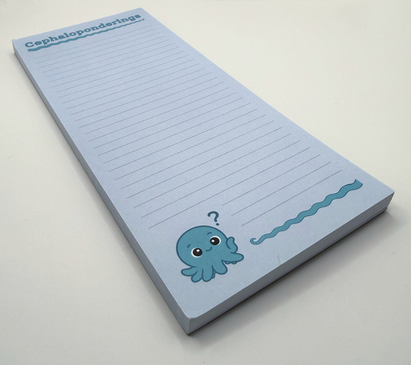 Front view: Cephaloponderings lined notepad.