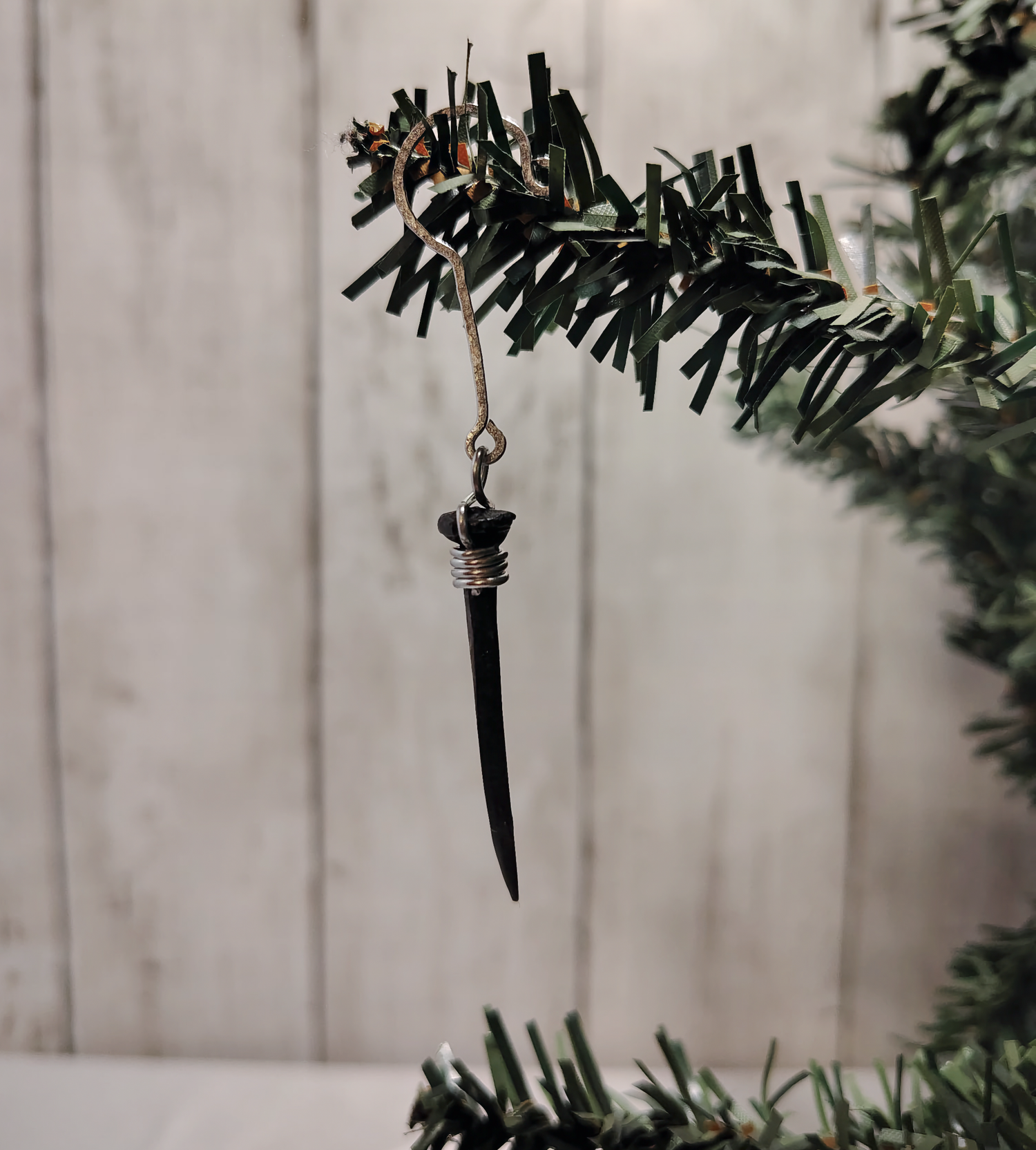 Black coffin nail ornament, hand-wrapped in 18-gauge aluminum wire