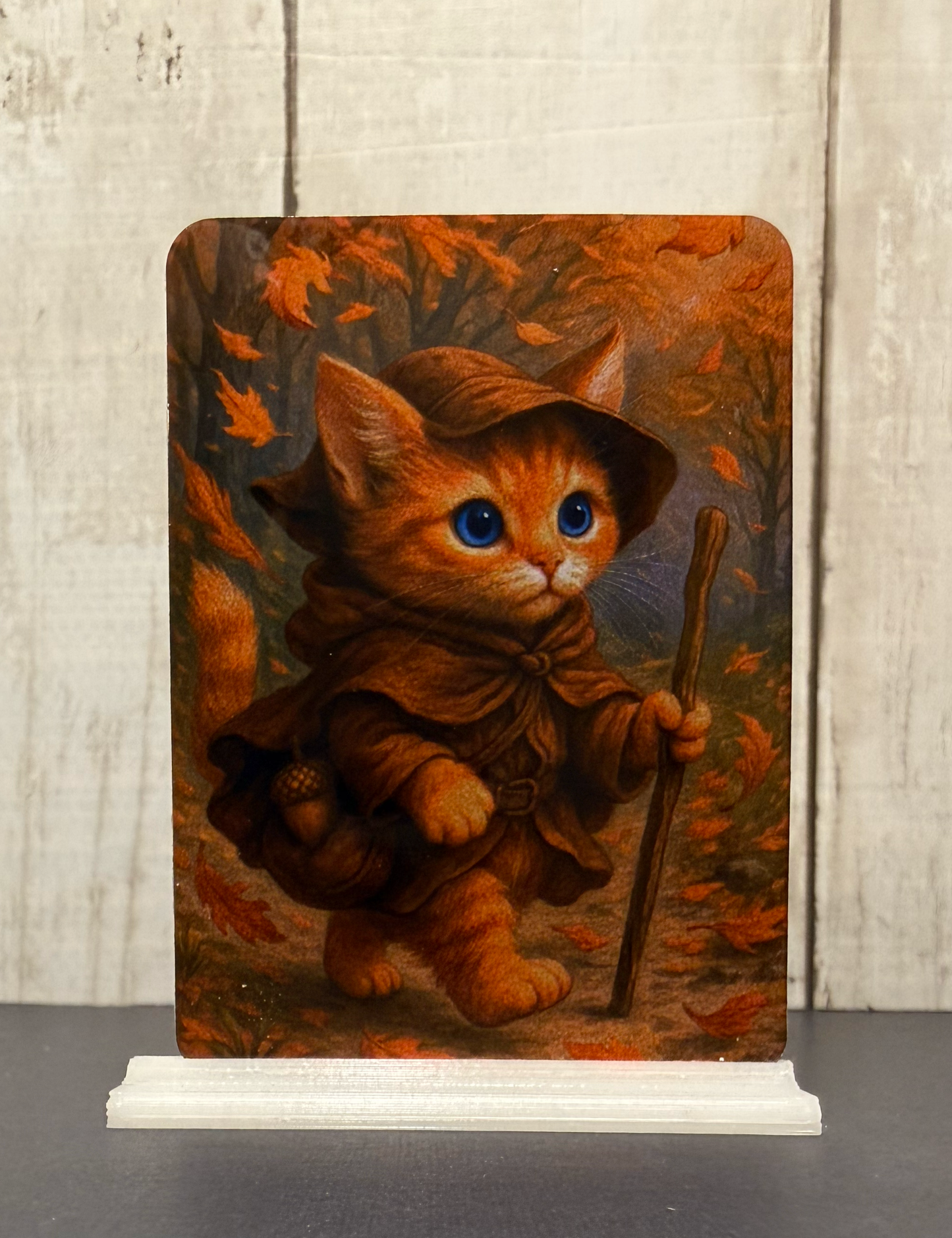 Magnet featuring an adventurer kitty in the forest during autumn, surrounded by falling leaves
