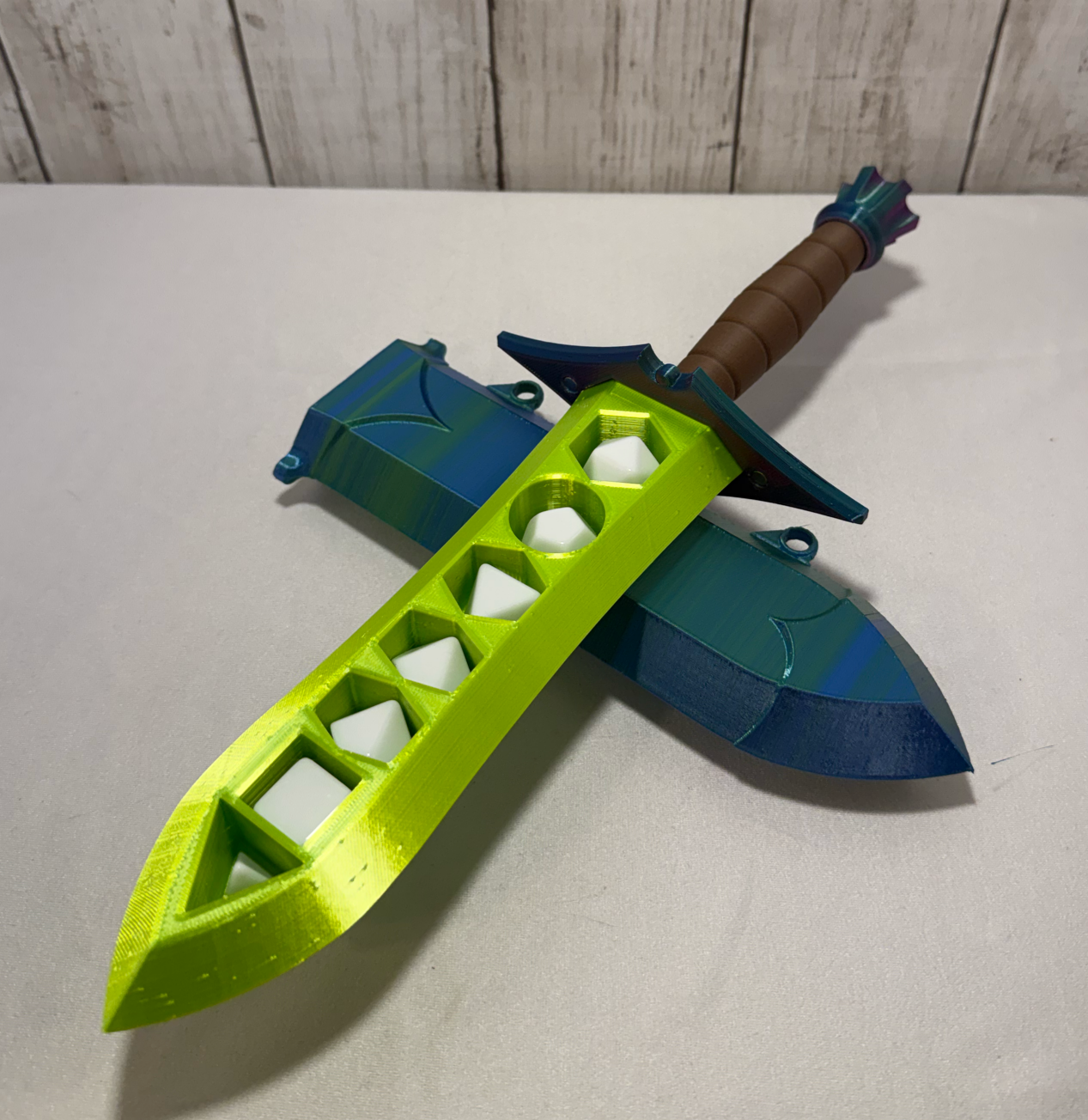 3D-printed dice sword with neon green blade, green pommel, brown handle, and matching sheath.