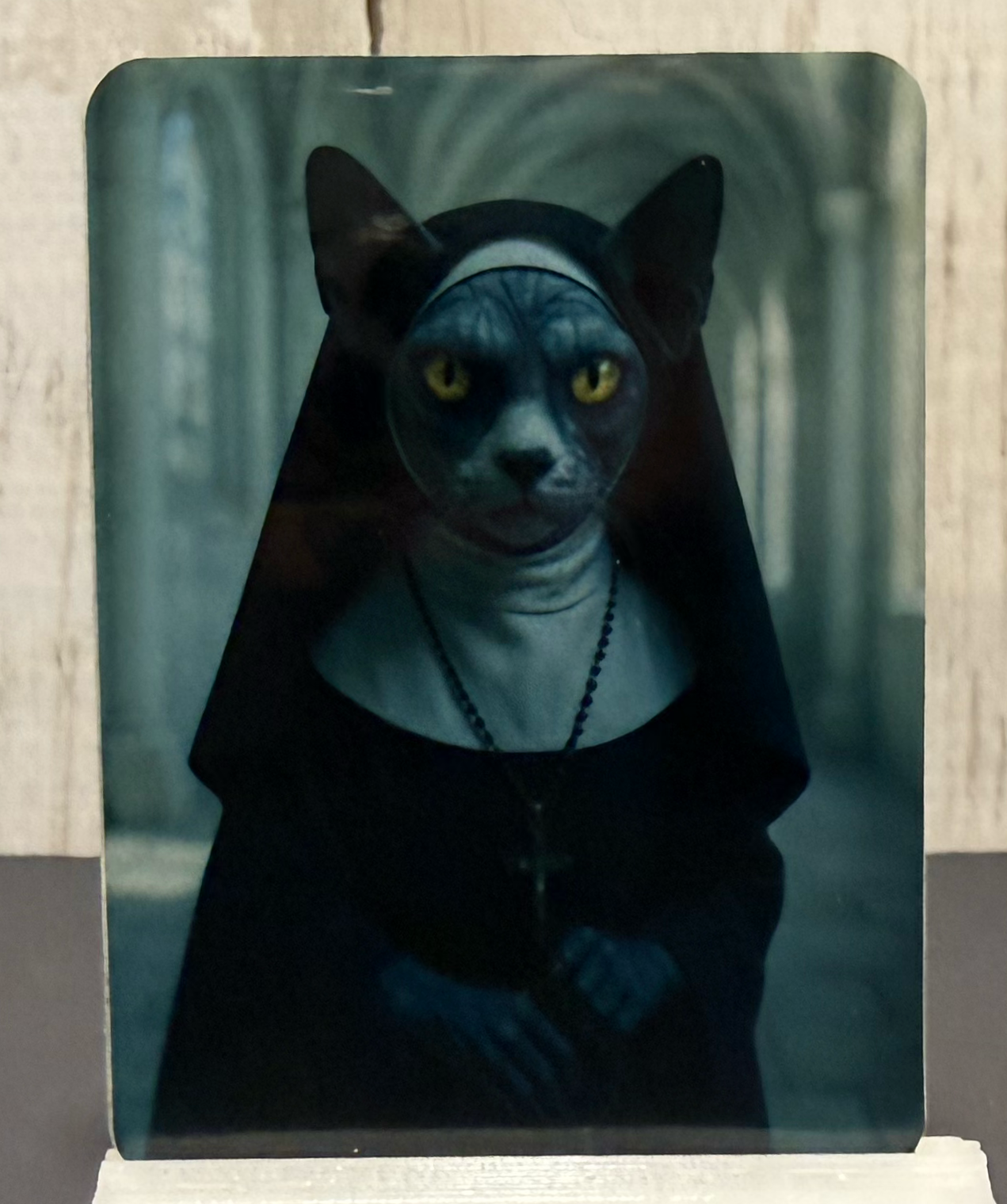 Magnet featuring a creepy nun cat