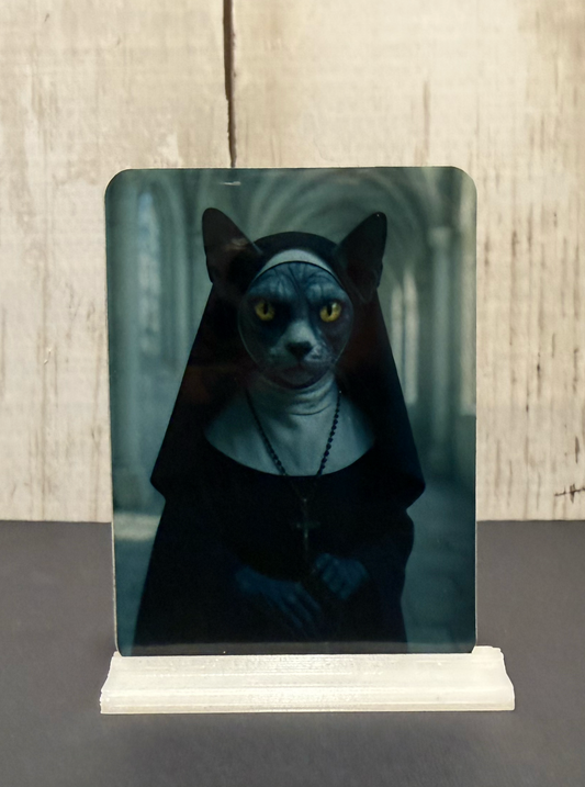 Magnet featuring a creepy nun cat